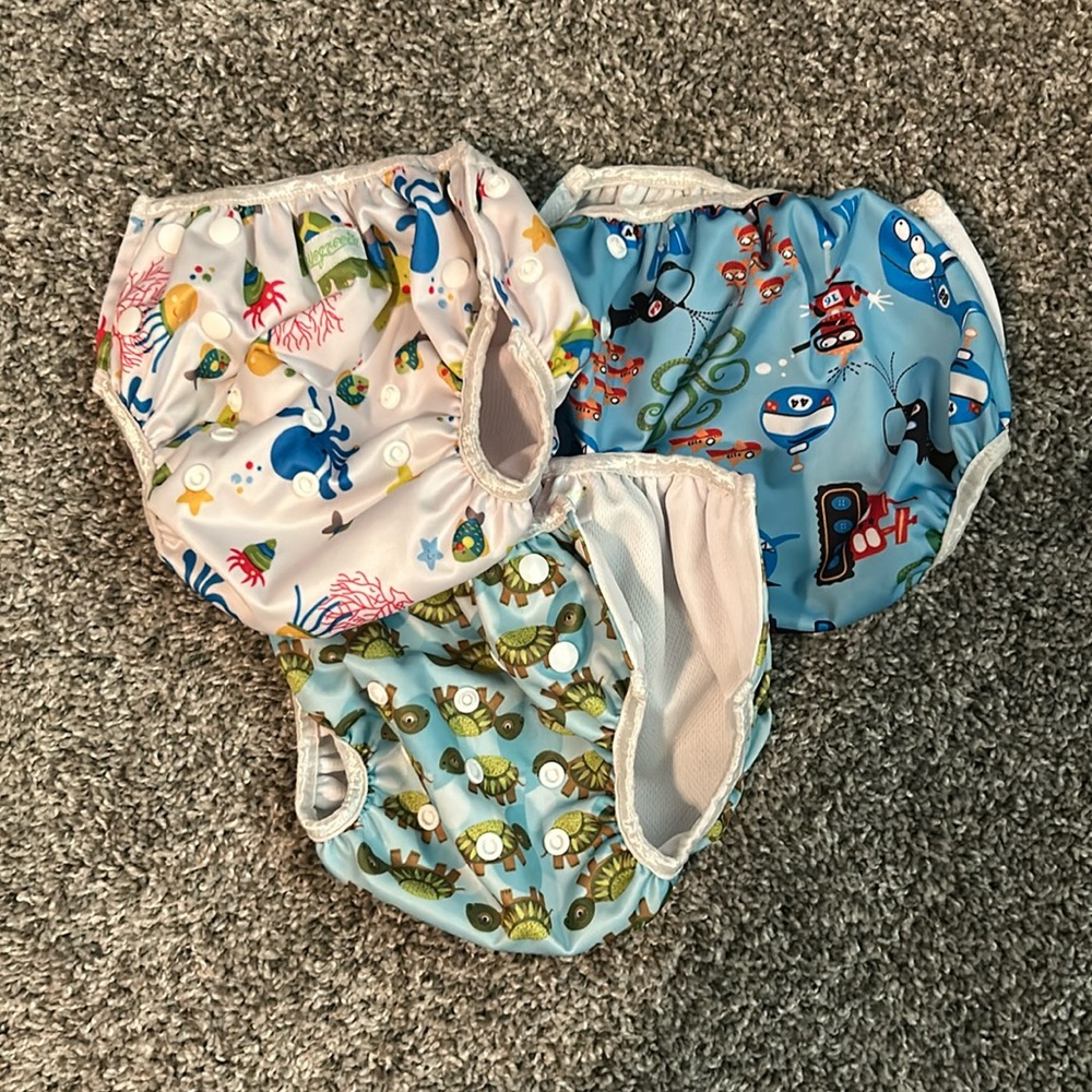 Adjustable reusable swim diapers set of 3 with snap closures to adjust size